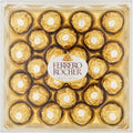 Ferrero Rocher chocolates in a clear tray, round gold-wrapped pieces with white centers
