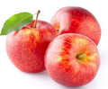 Red Annurca apples in a fresh fruit cluster, with stems and leaves