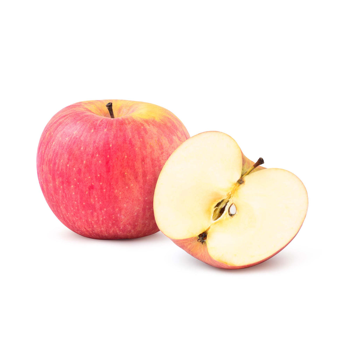 Red and yellow Fuji apples, with one whole and two cut halves
