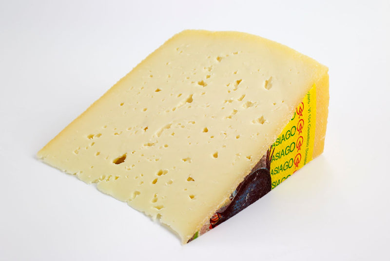 Asiago cheese wedge, pale yellow with small holes, 250g
