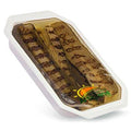 Roasted eggplant slices in white foam tray, dark brown grilled and golden edges